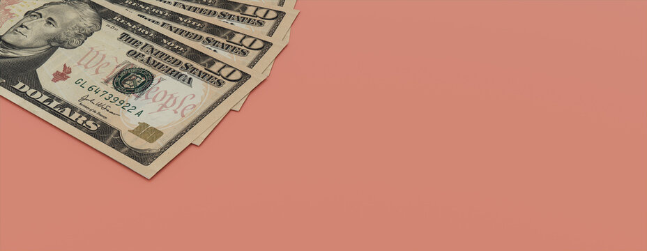 Finance concept with Ten Dollar Bills on a Pink surface. Currency Banner with copy-space.