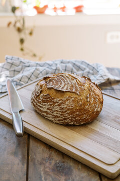 photo of a bread loaf on a cutting board