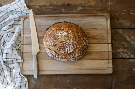 photo of a bread loaf on a cutting board