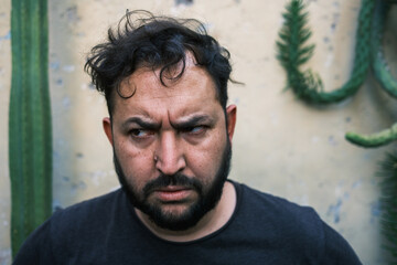 man making a surprised or frightened face 