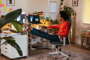 Mixed race man working on project on computer