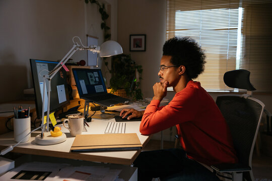 Thoughtful mixed race man analyzing data