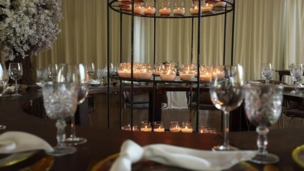 Close-up shot of luxury banquet with elegant cutlery and glassware. Charming event venue within beautiful interior. High quality FullHD footage
