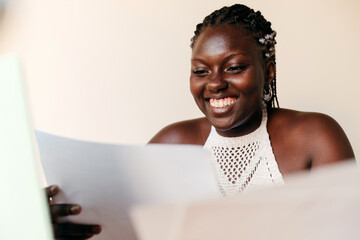 Black woman looking at her thesis project