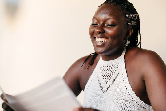 Black woman looking at her thesis project