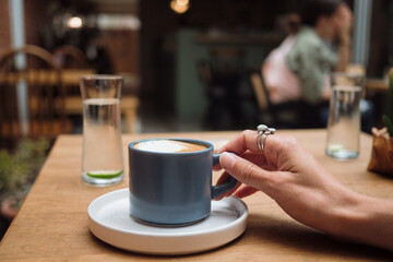 Closeup of a cappuccino coffee in a cup pov shot