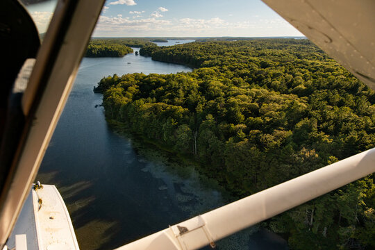 Float Plane Flying Over River