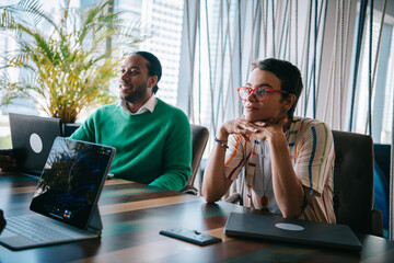 Thoughtful businesswoman listening at the meeting