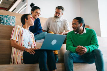 Group of colleagues having a meetup in creative co-working space