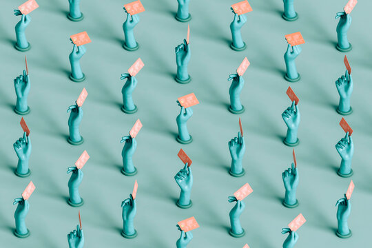 pattern of blue hands with credit cards