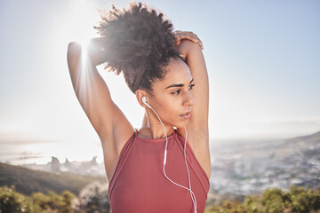 Fitness, stretching and black woman with headphones in city for warm up to start running. Wellness,...