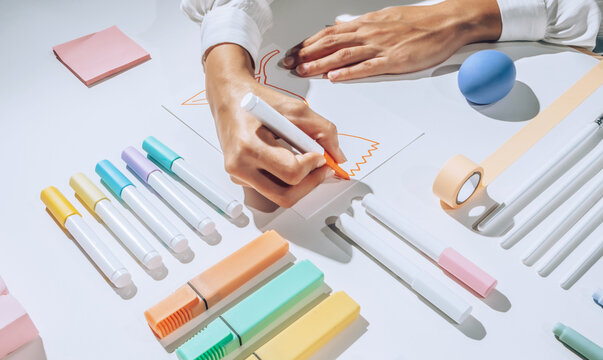 Illustrator drawing on white paper