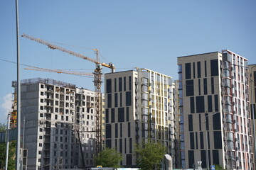 Fototapeta na wymiar Almaty, Kazakhstan - 04.26.2022 : Construction of a high-rise residential complex near a road junction.
