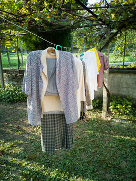 Airing clothes outdoors in backyard. 