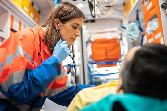 Paramedic woman working in ambulance