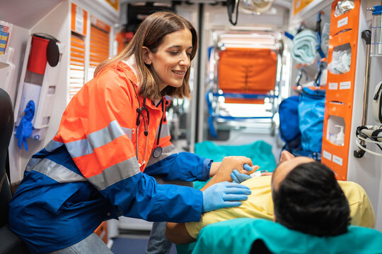 Paramedic woman working in ambulance