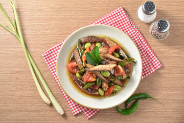 Tumis ikan pindang cue cabai hijau. Practical, fast, and appetizing home recipes. Made from deep-fried tuna and then stir-fried with green chilies, tomatoes, and petai. Served on plate, recipe menu