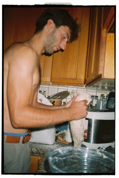 Young man preparing bread with sourdough