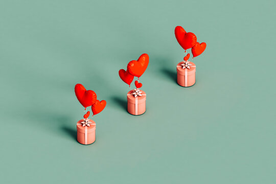 three pink presents with balloons