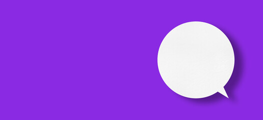 White paper in the shape of speech bubbles against a purple background. communication bubbles