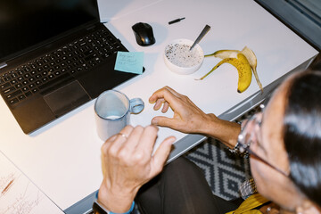 lo-fi portrait with flash of a business woman in home office