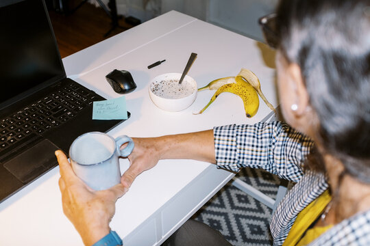 lo-fi portrait with flash of a business woman in home office