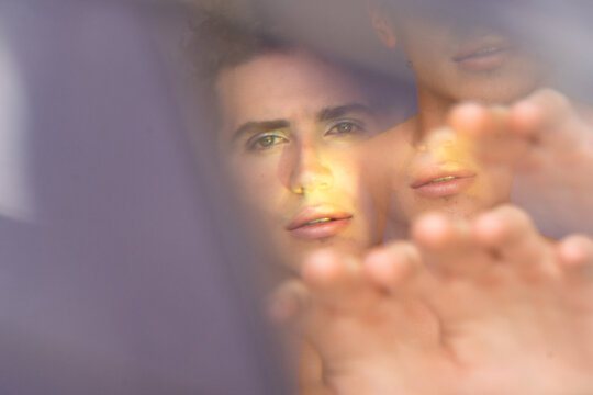 Male Model in Makeup Look Poses in Studio