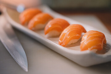 Salmon sushi is a popular fish dish. sushi is a street food of japan and new business in the world.