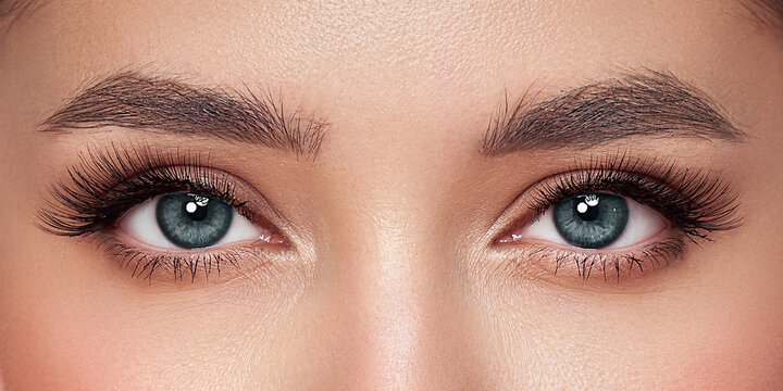 Female Eye with Extreme Long False Eyelashes. Eyelash Extensions. Makeup, Cosmetics, Beauty. Close up, Macro