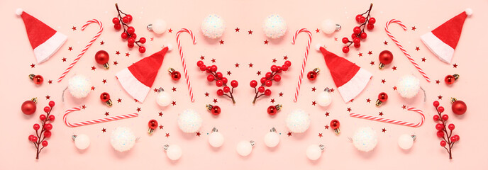 Composition with Santa hats, Christmas decorations and candy canes on pink background, top view