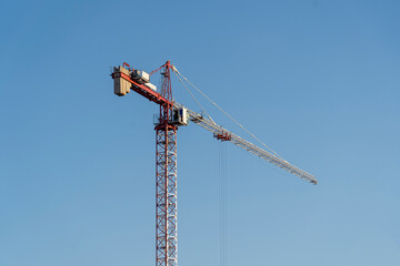 ,tower crane against the sky and Ostankino TV tower