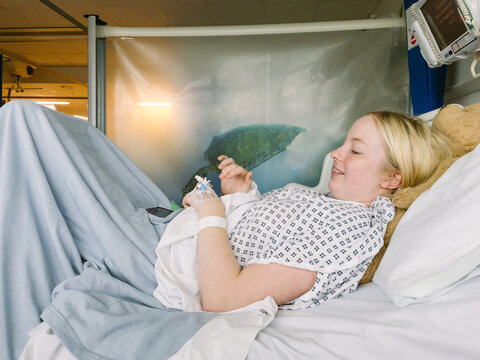 Teenage girl in a hospital bed.