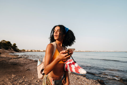 Traveler looking for a location with her phone