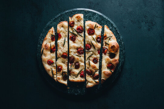 Italian focaccia with tomatoes and herbs