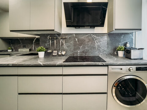gray kitchen with minimalist style furniture and modern apartment