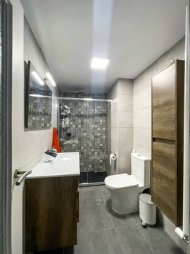 Bathroom with shower cabin and sink