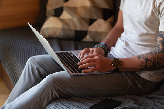 Anonymous Man Working On A Laptop