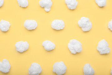 Natural cotton wool on yellow background