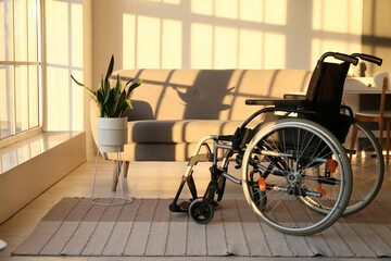 Modern empty wheelchair in living room