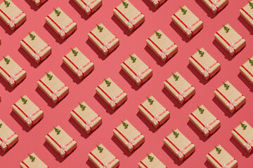 Gift boxes and Christmas decorations on red background, flat lay