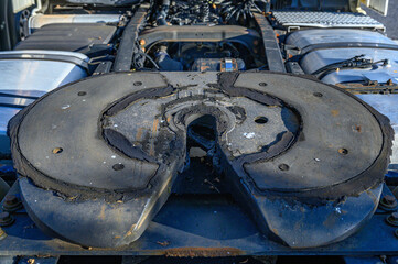 close-up of the support or hitch point of a truck trailer on the back of the tractor unit, on the wheels, in a circular shape in a hole for the spike to enter, dry, without grease, as in disuse transp