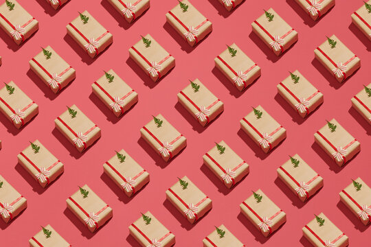Gift boxes and Christmas decorations on red background, flat lay