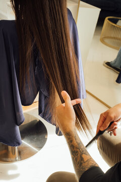 Close-up of Hairdresser Cutting Client's Hair