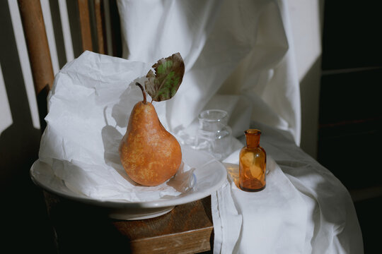 still life with pear in sunlight