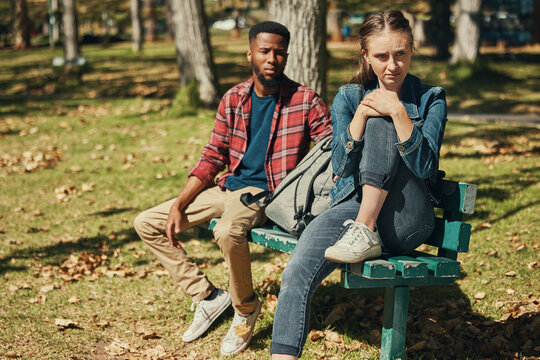 Angry, Fight And Interracial Couple In Conflict In A Park With Stress About Divorce, Mental Health And Marriage Fail. Depression, Sad And Black Man And Woman Frustrated With A Problem In Nature