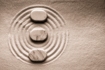 Fototapeta na wymiar Stones on sand with pattern, flat lay. Zen, meditation, harmony