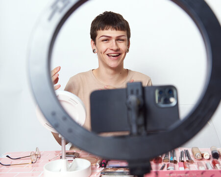 Beauty blogger recording a makeup routine
