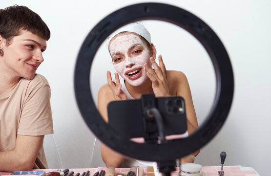 Beauty bloggers recording their makeup routine