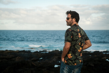 Man standing and looking seascape