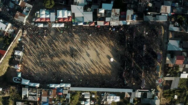 Annual Event Of Sumpango Kite Festival Attending By Many Locals In Sumpango Cemetery, Guatemala. Aerial Drone Ascending Shot